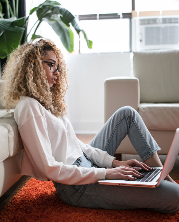 Conscience of the Organization - woman on floor with laptop